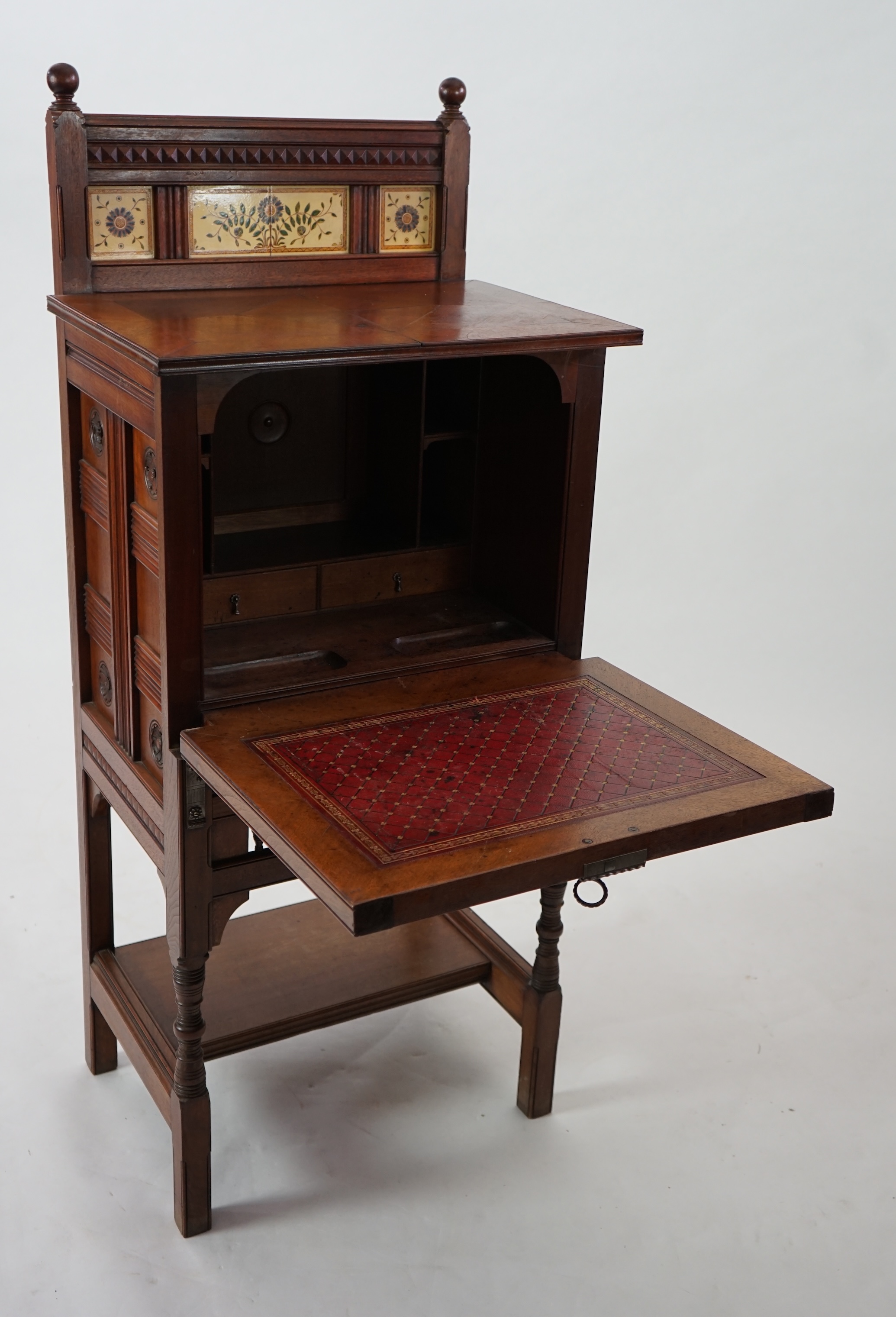 A Victorian Aesthetic Period walnut fall front desk attributed to Bruce James Talbert (1838-1881)